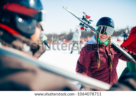 Skiers with skis and poles, extreme lifestyle
