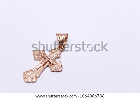 Gold cross, christening Royalty-Free Stock Photo #1064086736