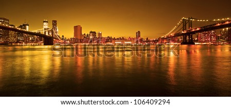 Manhattan Bridge and Manhattan skyline At Night Royalty-Free Stock Photo #106409294