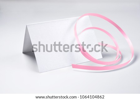 Blank thank you card decorated with rose ribbon