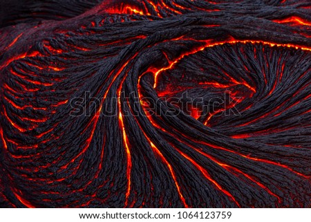 rapidly cooled lava crust creates an abstract  Royalty-Free Stock Photo #1064123759