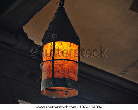 Antique artistic lighted lamp hanging from the ceiling