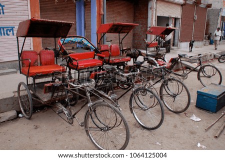 cycle rickshaws lined up ready in India