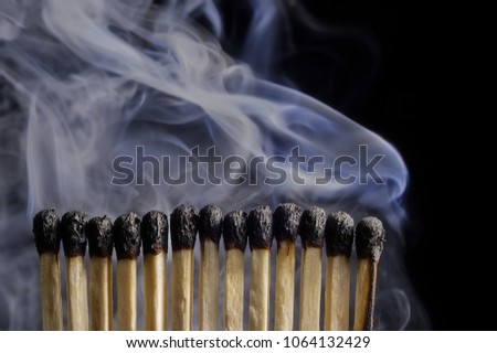 Smoking many security match on black background