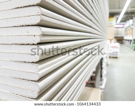 The stack of gypsum board preparing for construction Royalty-Free Stock Photo #1064134433
