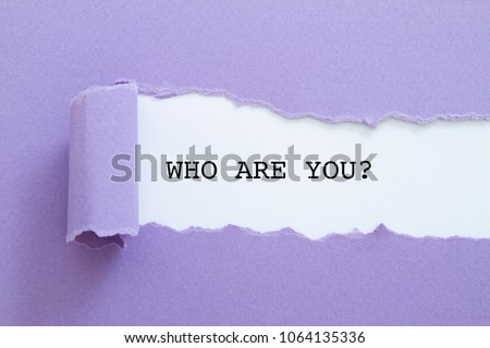 Who are you? question written under torn paper. Royalty-Free Stock Photo #1064135336