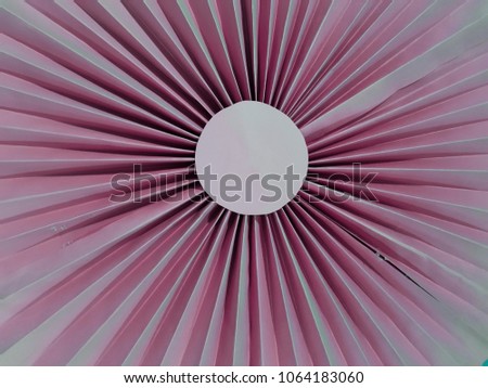 abstract figure with folded paper in light pink, a circle, like sun, background and texture