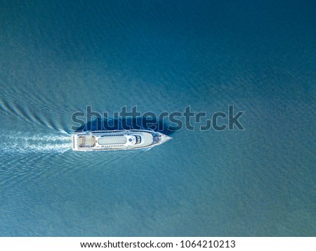 aerial ferry in the sea on a sunny day blue water isolated Royalty-Free Stock Photo #1064210213