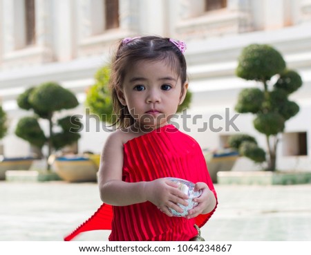 Thai kids in Songkran festival at the temple in Thailand