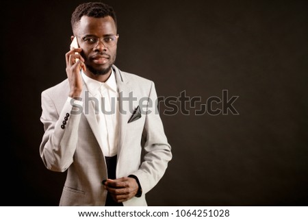 close up image of Afro guy with smart phone. using mobile phone