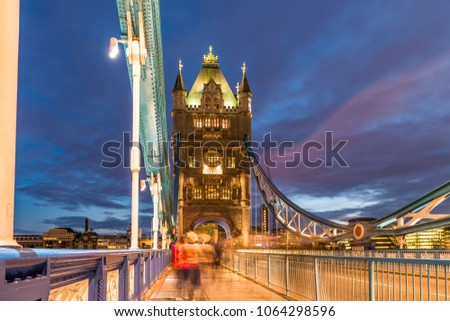 Tower Bridge on Thames river at night in London, UK
