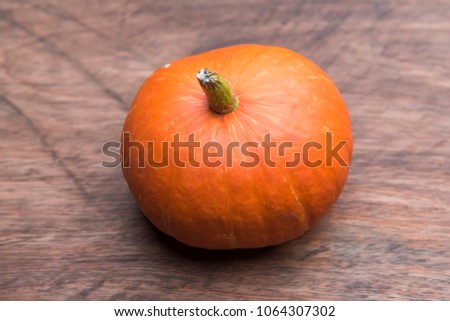 harvest of orange raw pumpkins harvest on table, top view