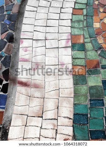 Detail of beautiful old collapsing abstract ceramic mosaic adorned building. Venetian mosaic as decorative background. Selective focus. Pattern. Mosaic colored ceramic stones