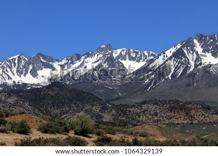 Mt. Humphreys and Mt. Emerson in the Eastern Sierra Nevada.  Seen from the Buttermilks.  Bishop, California. Royalty-Free Stock Photo #1064329139