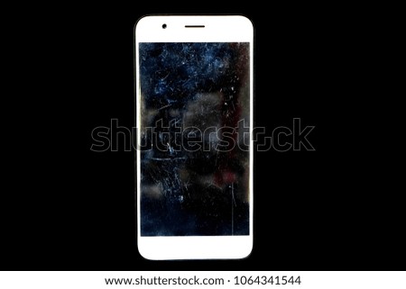 White cellphone on black background have scratches on film that protect screen mobile