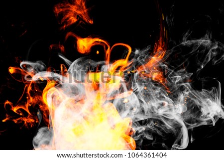 Fire flames background. Cloud of  fiery smoke on a black isolated background. Background from the smoke of vape