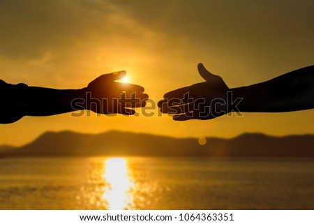 Silhouette of helping hand concept and international day of peace, Expression of Business Collaboration, Help hand.