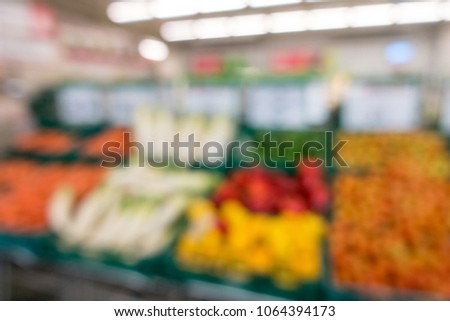 Defocused of vegetables and fruits in supermarket for background.