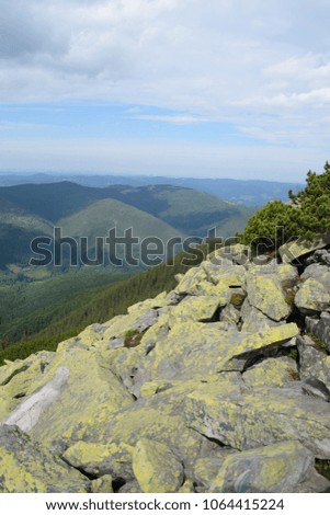 stone slope against the background of mountains and sky