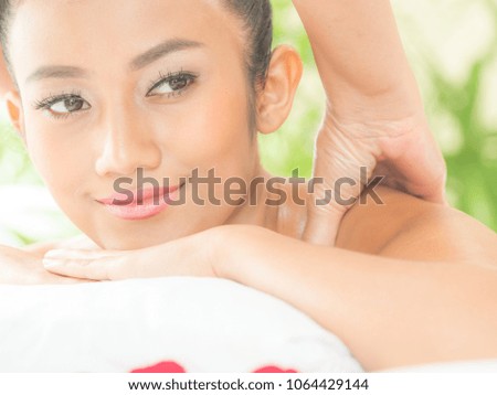 Young asian beautiful woman relaxing in spa salon