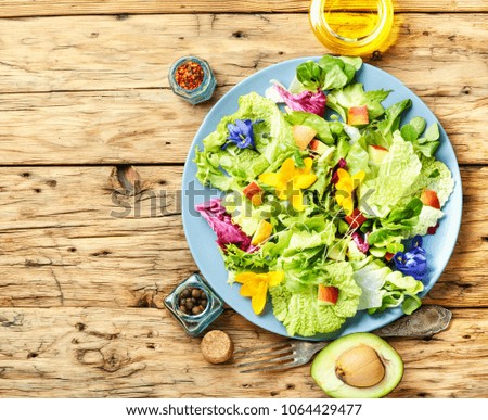 Vegetarian salad leaves with herbs and flowers.Healthy food