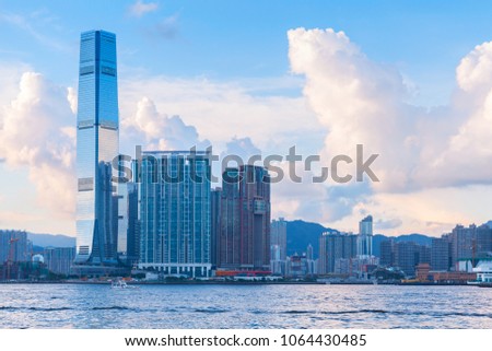 Modern cityscape with skyscrapers. International Commerce Centre of Hong Kong under cloudy evening sky