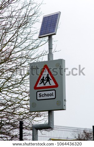 A modern solar powered children's  school road sign warning with audio alert in Bangor Northern Ireland