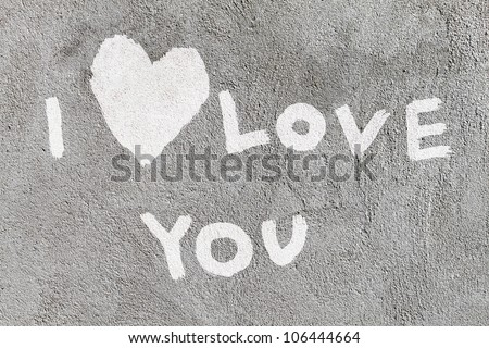 inscription I Love you with abstract heart on the concrete wall