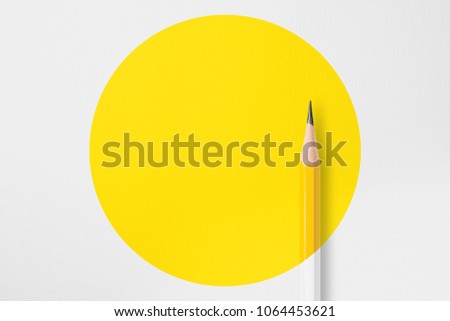 Presentation template with copy space by top view close up macro  photo of wooden yellow pencil put on texture white paper and combine with yellow circle shape.Flash light made soft light on pencil. Royalty-Free Stock Photo #1064453621