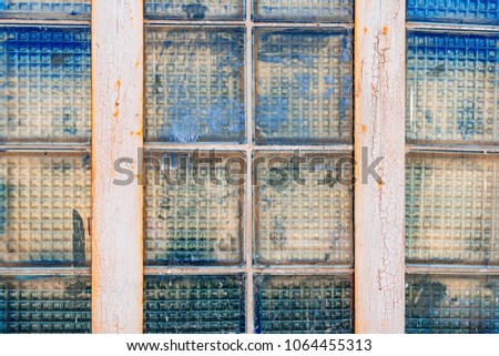 Old cracked window. Grunge background of glass.