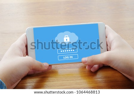 Hand using smart phone with cloud data storage password login on screen, cyber security concept