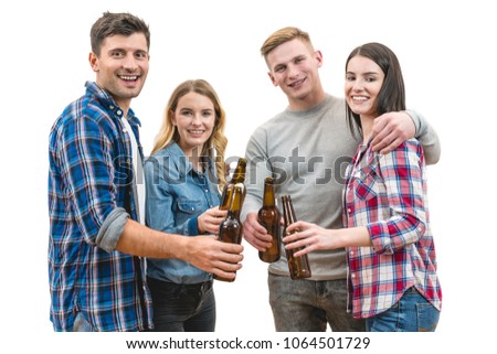 The four happy people hold bottles of beer on a white background