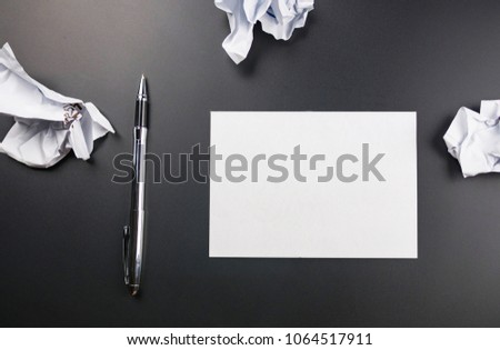 Empty paper with crumpled paper balls 