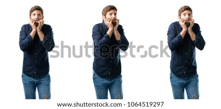 Young man with beard terrified and nervous expressing anxiety and panic gesture, overwhelmed isolated over white background