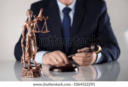Judge holding gavel. Law and justice.