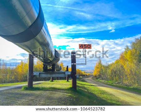 Alaska oil pipeline shows 450 distance miles sign at Alyeska Pipeline Visitor's Center