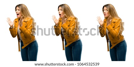 Beautiful young woman stressful keeping hands on head, terrified in panic, shouting over white background