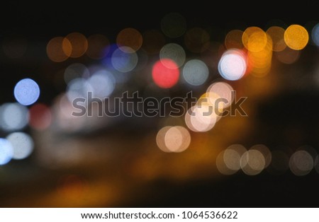 Defocused night traffic lights from cars. Abstract blur background.