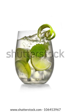 Cocktail with mint and lime in glass on white background