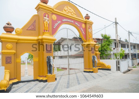 Image of an elephant on the gate of a Buddhist temple.