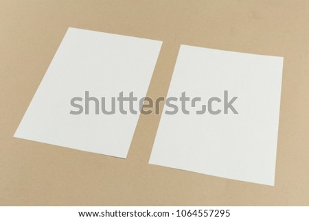 White business card on wooden table. Blank portrait A4.
