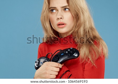  woman with joystick looking up                              