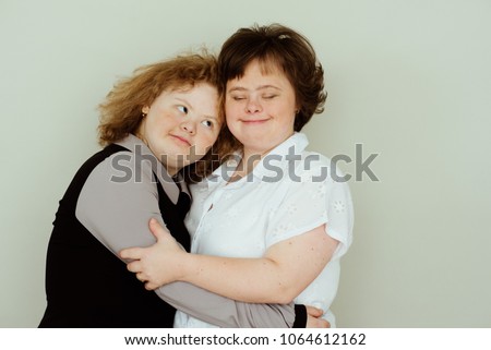 Girl in studio, She's my precious treasure. girls with down syndrome Royalty-Free Stock Photo #1064612162