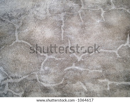 Stock macro photo of the texture of discolored concrete.  Useful for layer masks and abstract backgrounds.