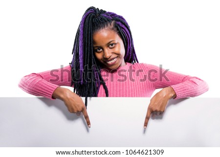 Happy black girl pointing at a banner