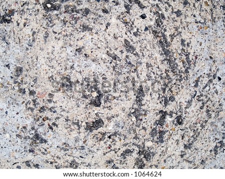 Stock macro photo of the texture of discolored concrete.  Useful as a layer mask or abstract background.