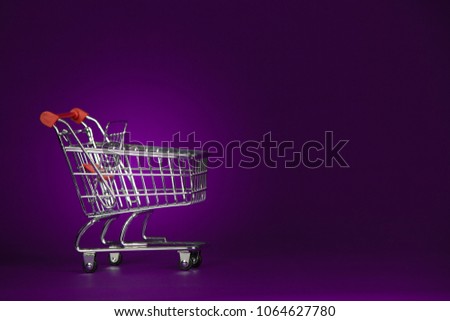 Shopping Cart Trolly Isolated on Gradient Purple Background Royalty-Free Stock Photo #1064627780