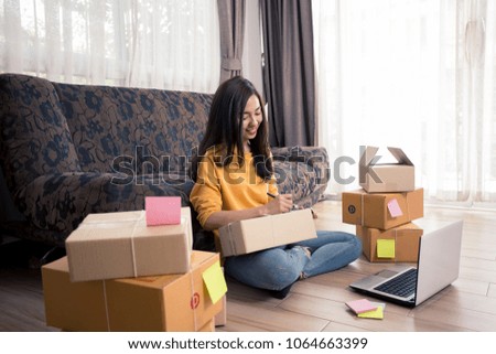 beautiful asian young woman working on laptop computer at home, startup Online Marketing concept