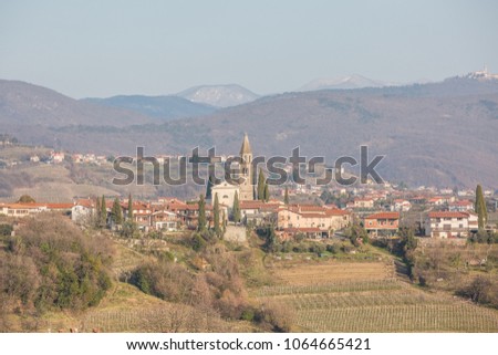 Panoramic view of a rural village with vineyards in the alps near Dobrovo, Slovenia