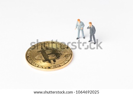 Miniature looking to  Bitcoin on white background, Digital Money and Bitcoine Concept.